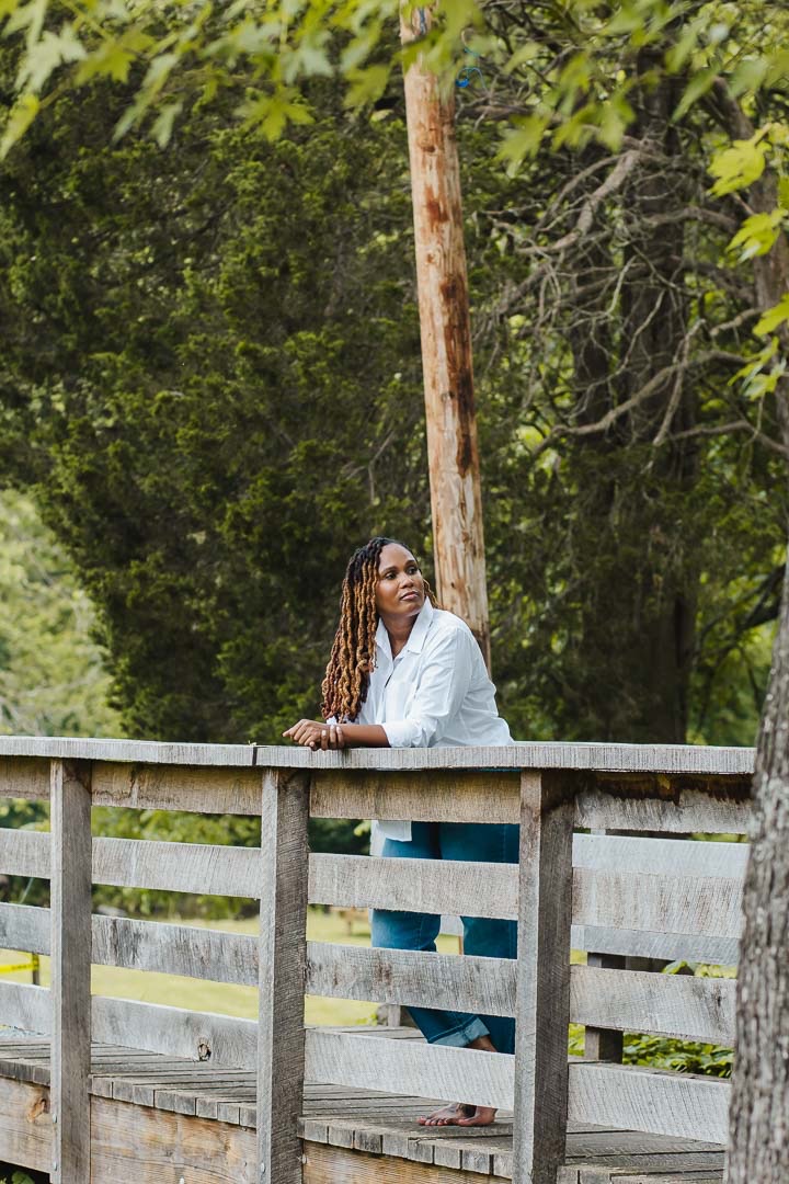 Charika White, the Jamaican born psychotherapist and author of Island Mind, Foreign Ground, standing on a bridge in Maryland