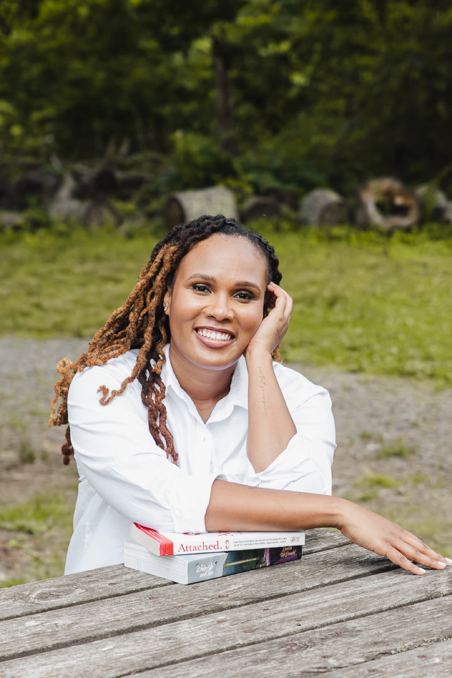 Charika White, board-approved clinical supervisor for social workers in Washington DC and Maryland, with attachment theory books